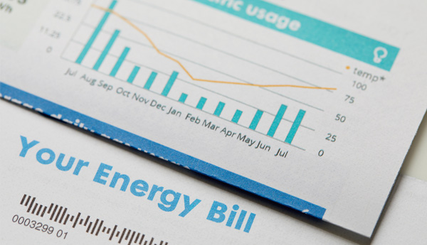 A folded up paper bill showing a graph of energy usage with the words Your Energy Bill printed in bold letters.